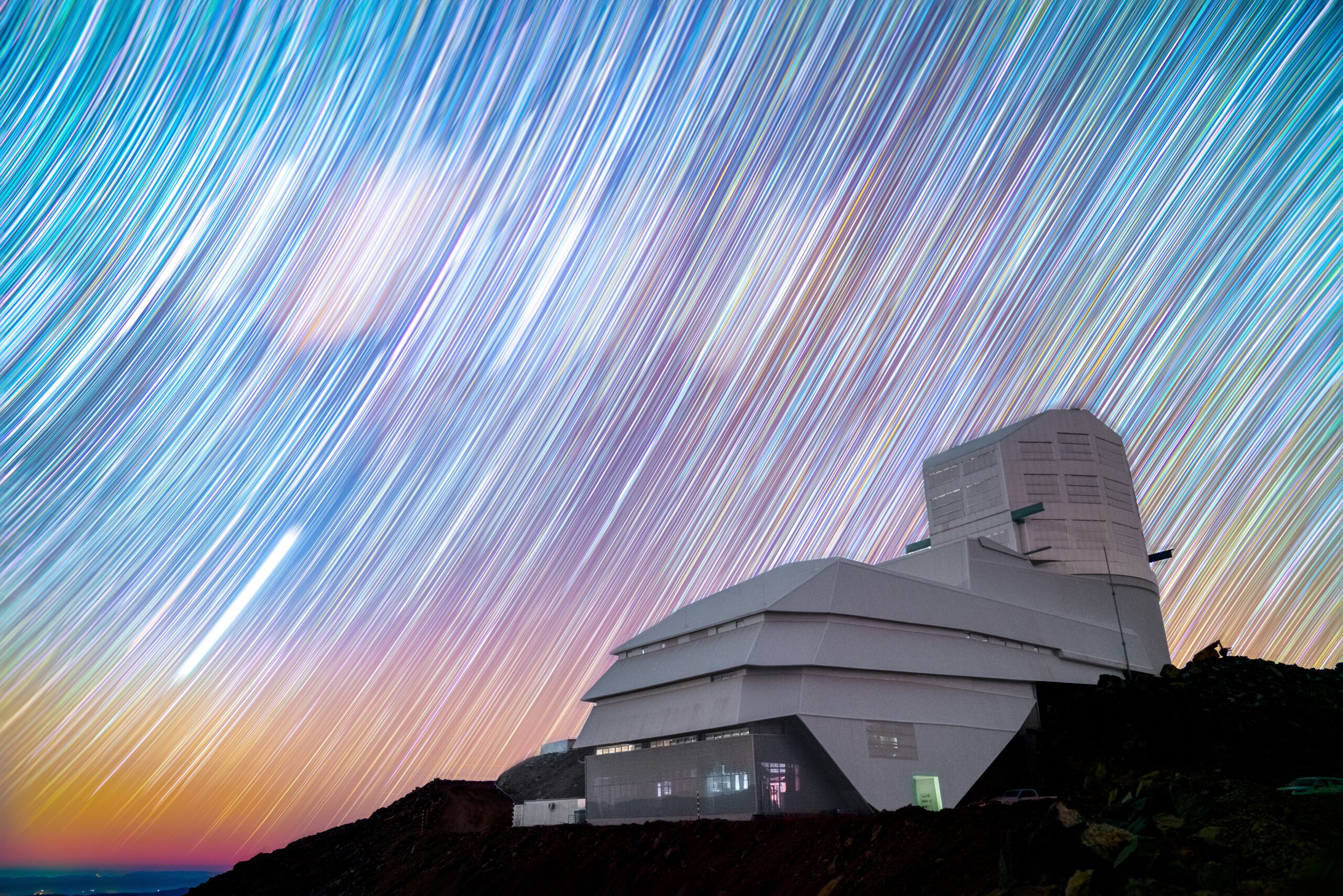 Colorful star trails behind the Vera C. Rubin Observatory in Chile.